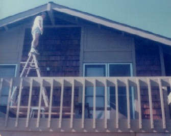 17. 1970s - dad up a ladder on balcony above garage.